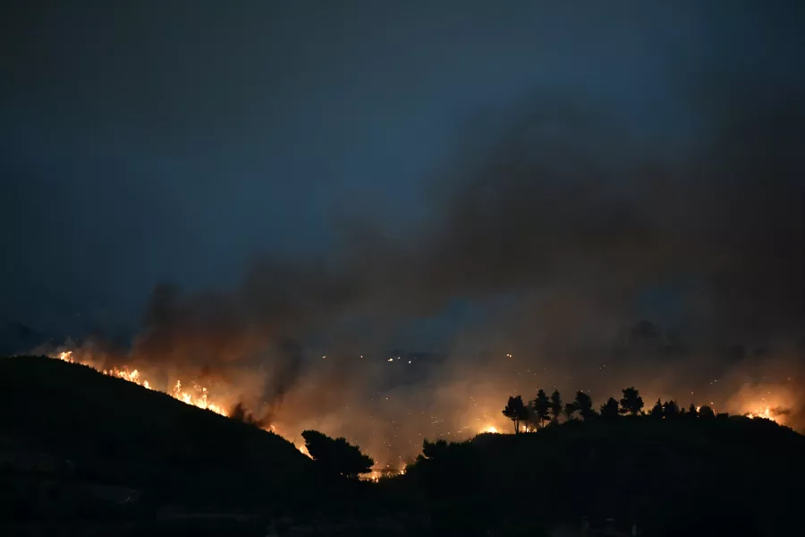 A wildfire burns a forest in Afidnes area, northern Athens (Michael Varaklas/AP)