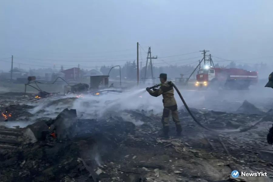 A firefighter douses a fire in Byas-Kuel village 
