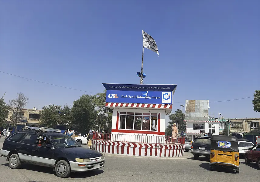 A Taliban flag flies in the main square of Kunduz city after fighting between Taliban and Afghan security forces, in Kunduz, Afghanistan