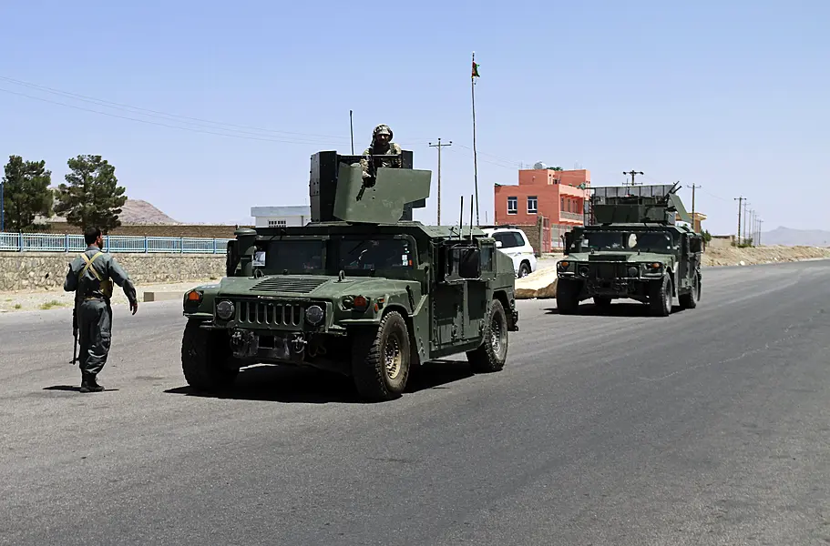 Afghan security personnel patrol after they took back control of parts of the city of Herat following fighting between Taliban and Afghan security forces, on the outskirts of Herat, 397 miles west of Kabul, Afghanistan 