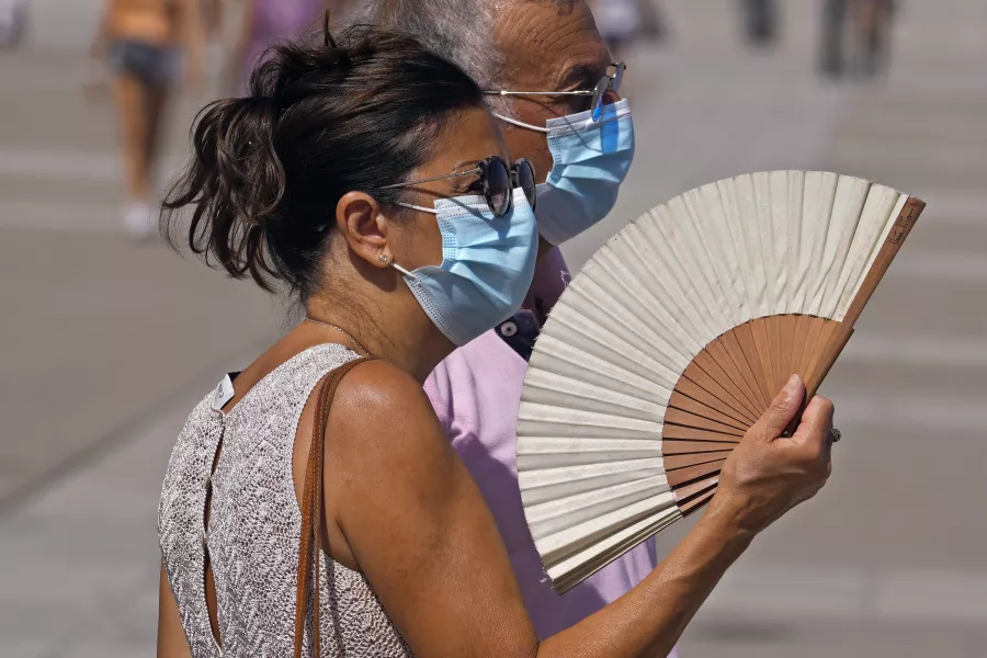 A woman fans herself in Madrid, Spain