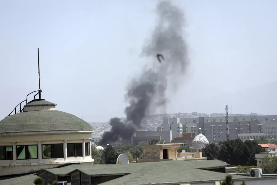 Smoke rises next to the US embassy in Kabul, Afghanistan