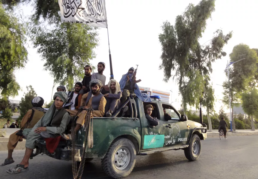 Taliban fighters patrol inside the city of Kandahar, south-west Afghanistan