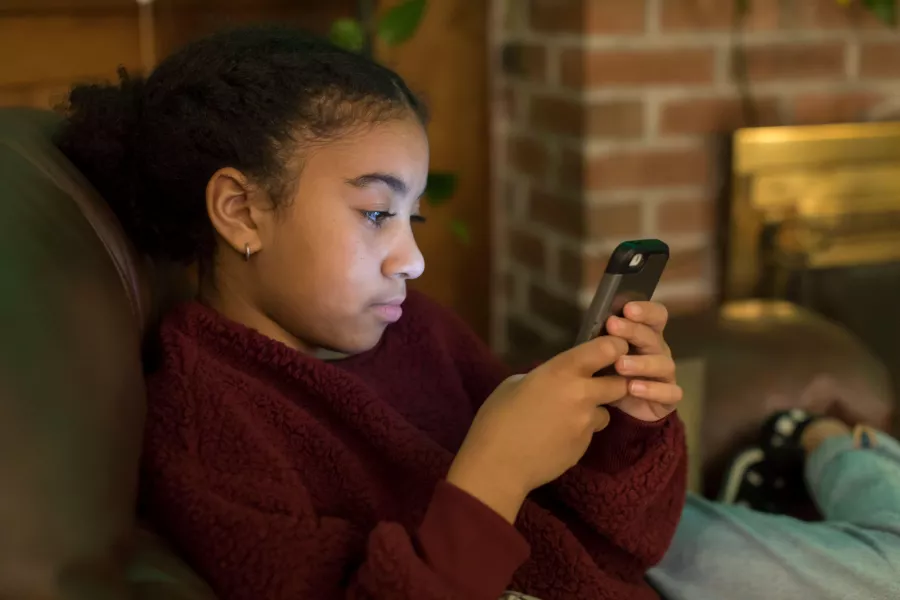 Girl looking at phone screen