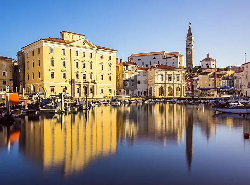 Main Square Tartini of Piran City reflected on water in Slovenia (Alamy/PA)