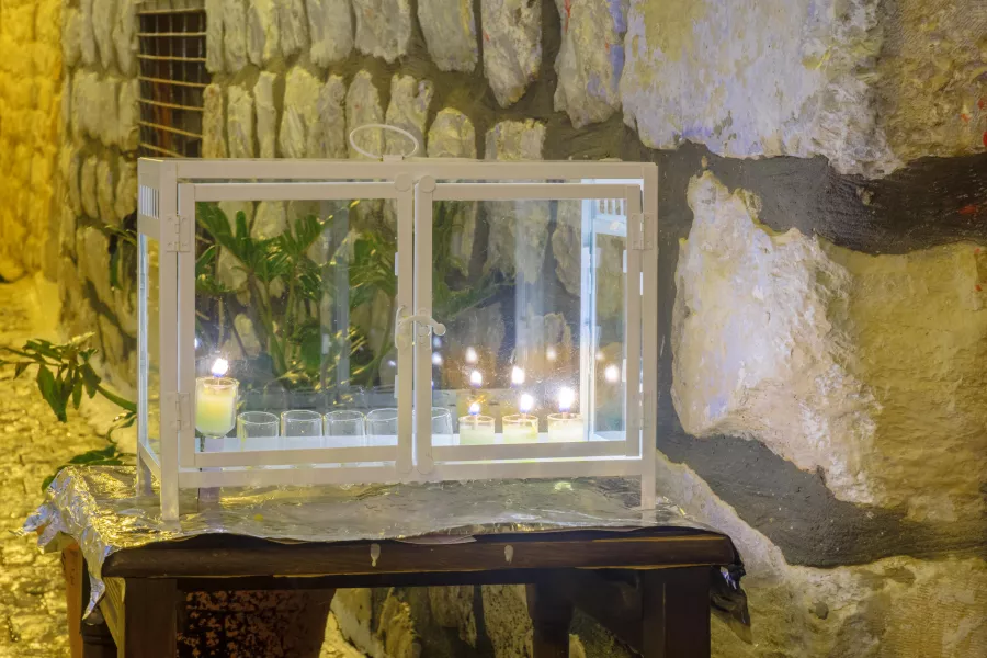 Traditional Menorah (Hanukkah Lamp) with olive oil candles, in the Jewish quarter, in Safed, Israel