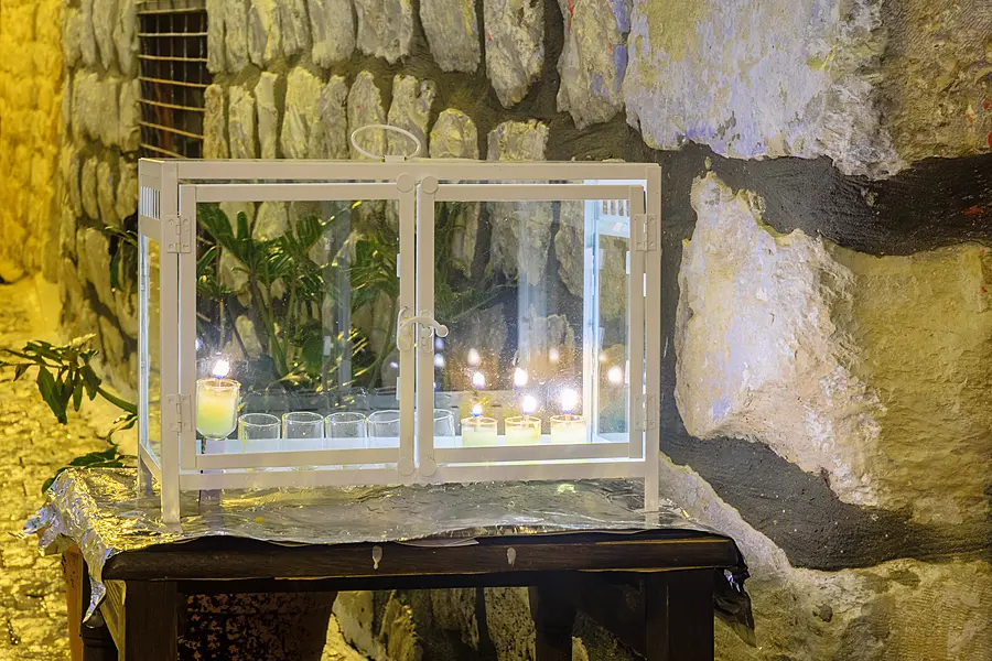 Traditional Menorah (Hanukkah Lamp) with olive oil candles, in the Jewish quarter, in Safed, Israel