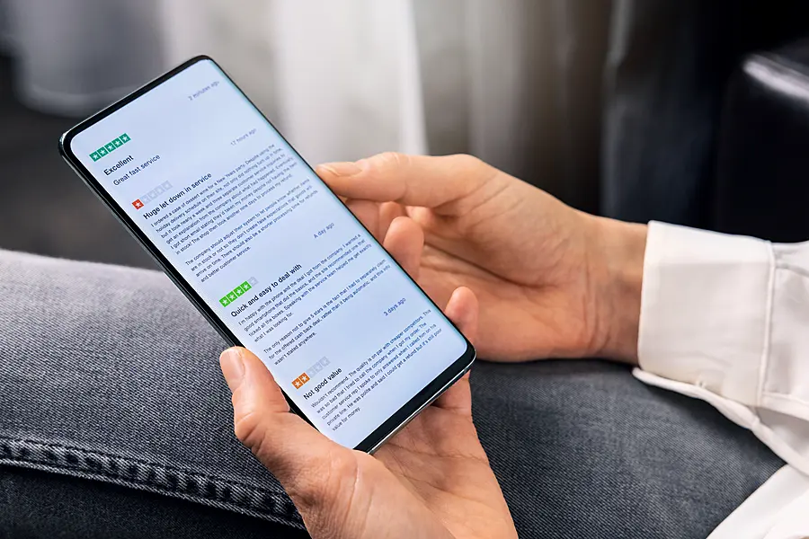 A woman checking reviews on her phone