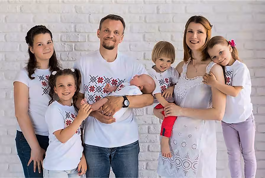 Volha Zalatar with her husband Sergei Gankevich and their children