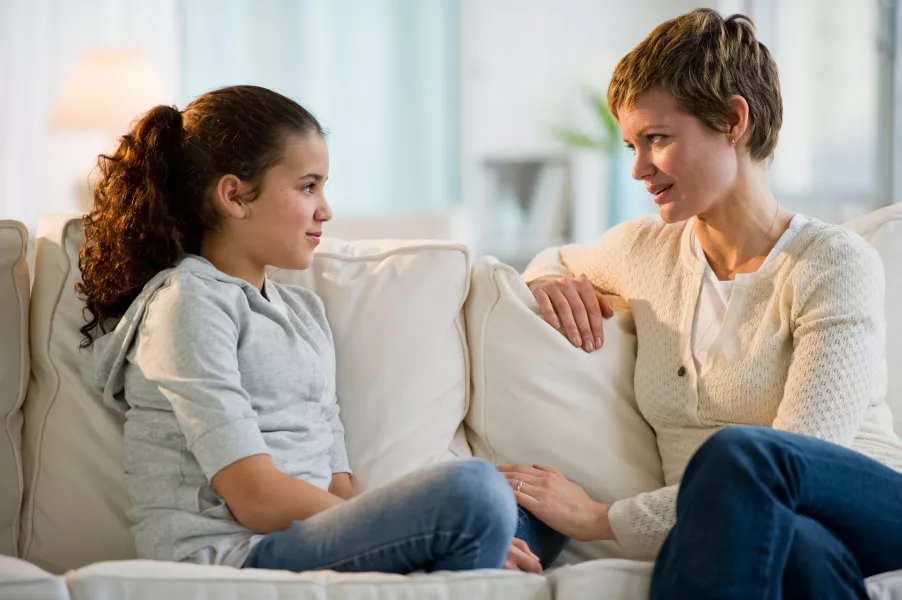 Mother and daughter having a serious conversation