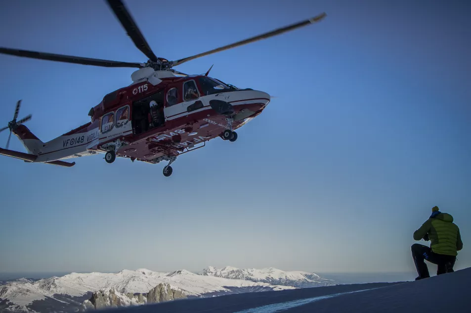 A firefighters' helicopter departs after transporting scientists on the slopes of the Mt Gran Sasso d'Italia in central Italy