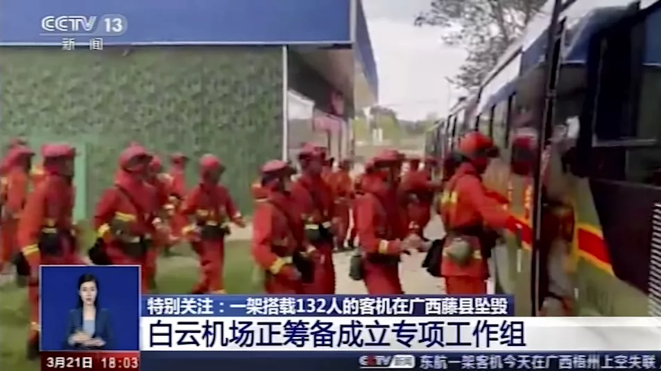 In this image taken from video footage run by China's CCTV, emergency personnel prepare to travel to the site of a plane crash near Wuzhou in southwestern China's Guangxi Zhuang Autonomous Region