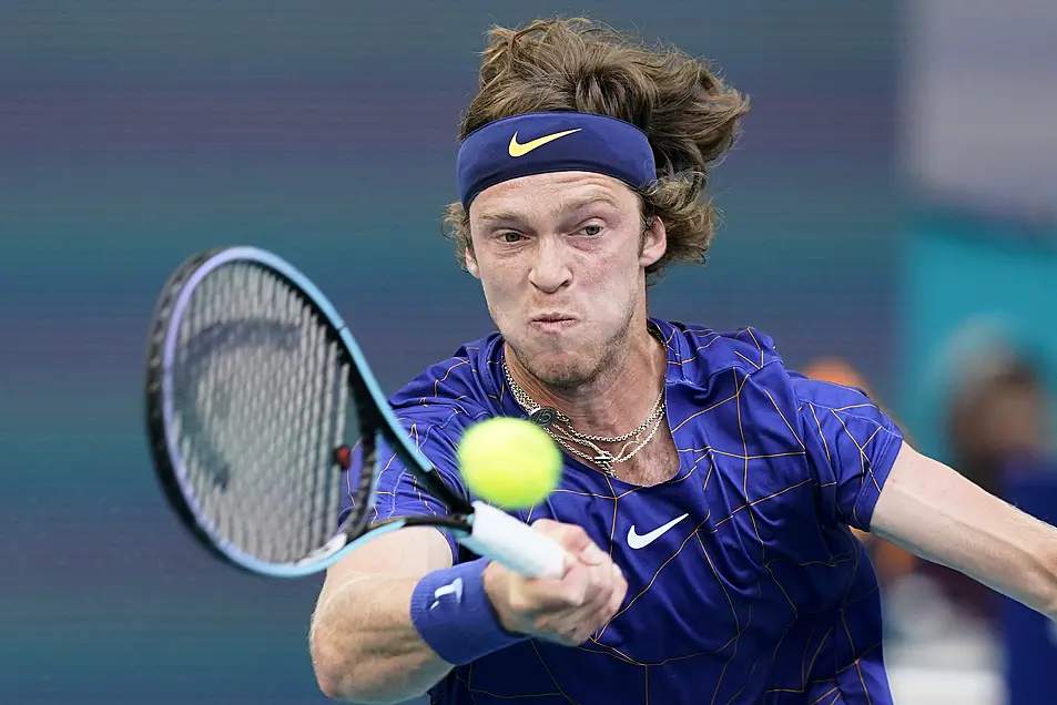 Andrey Rublev, of Russia, returns a shot from Nick Kyrgios, of Australia, during the Miami Open tennis tournament on Friday