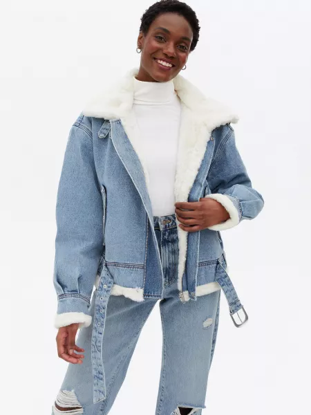 New Look Blue Denim Faux Fur Lined Aviator Jacket; White Ribbed Long Sleeve Roll Neck Top; Little Mistress Blue Ripped Straight Leg Jeans