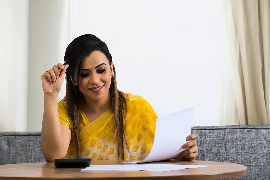 Woman working on her finances at home