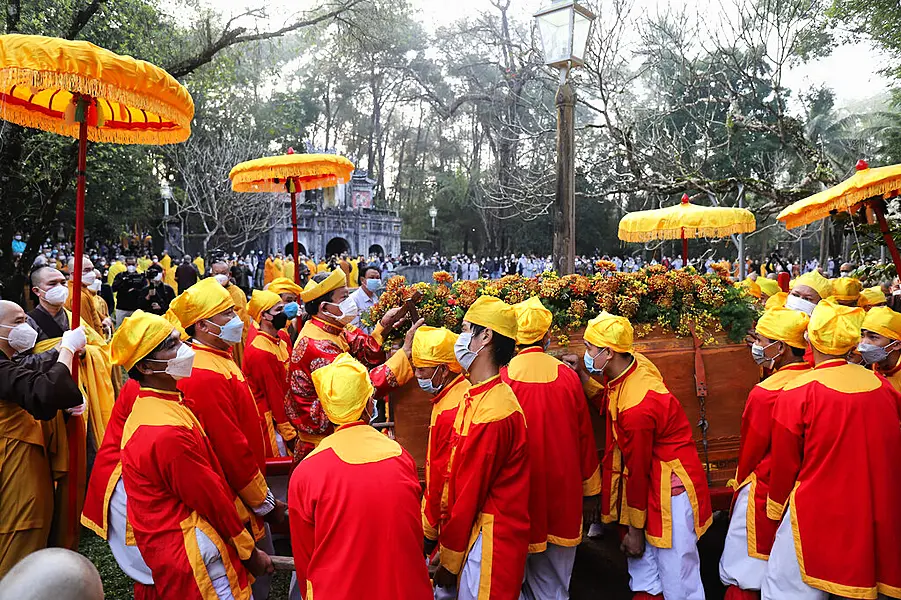 Pallbearers lift up the coffin of Vietnamese Buddhist monk Thich Nhat Hanh during his funeral in Hue, Vietnam Saturday, Jan. 29, 2022. A funeral was held Saturday for Thich Nhat Hanh, a week after the renowned Zen master died at the age of 95 in Hue in central Vietnam.