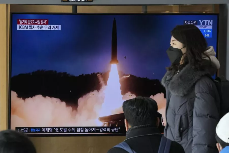 A TV screen shows a file image of North Korea's missile launch during a news program at the Seoul Railway Station in Seoul, South Korea, Sunday, Jan. 30, 2022. 