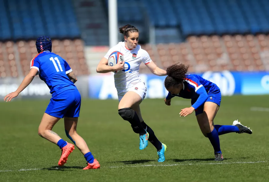 France's Caroline Drouin (right) tackles England's Emily Scarratt during the Guinness Women's Six Nations match