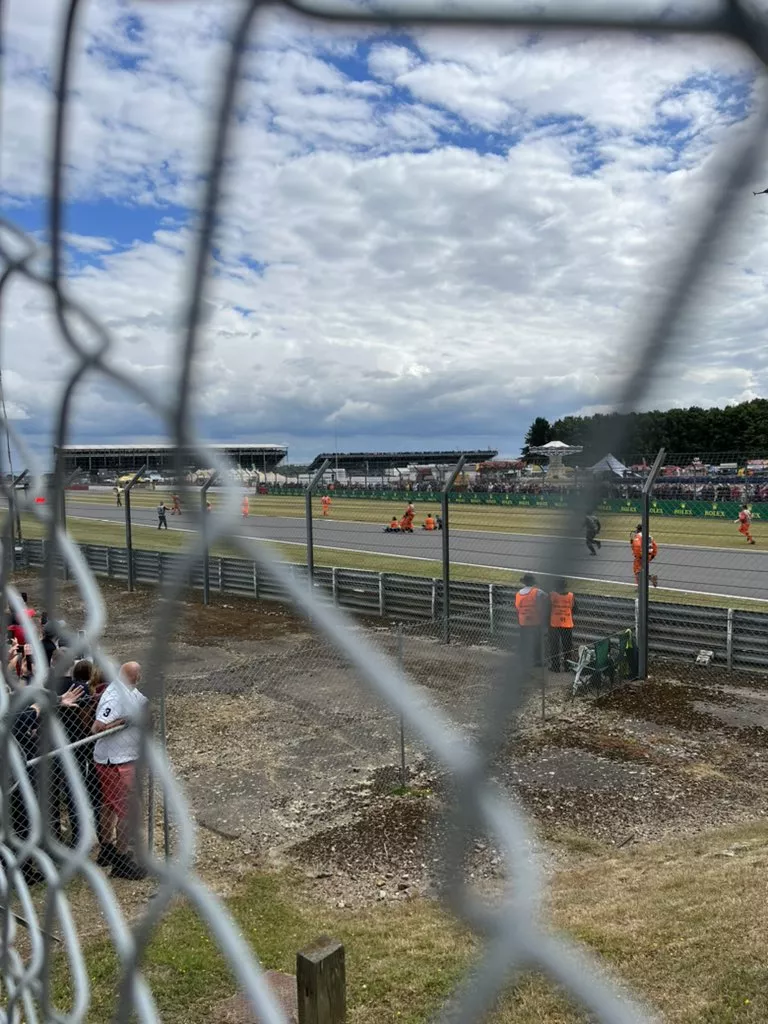 Protestors stormed the circuit at Silverstone before sitting down on the track