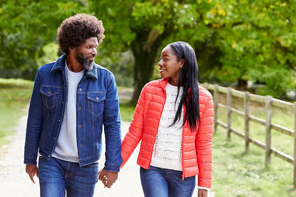 Couple walking and holding hands