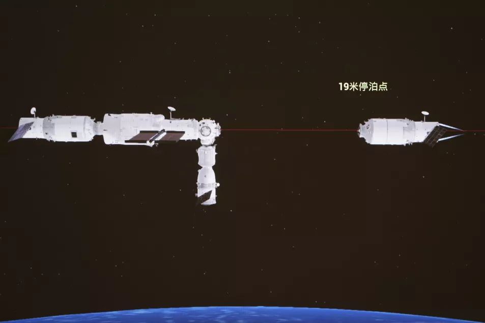 A computer-generated simulation screen image at the Beijing Aerospace Control Centre on July 17 shows the Tianzhou-3 cargo craft, right, separating from the orbiting station combination 
