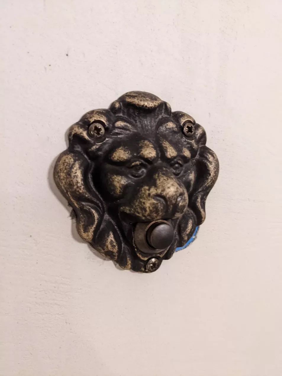 Hidden inside every room in Gatsby is one of these unassuming lion's head buttons. (Jonjo Maudsley/PA)