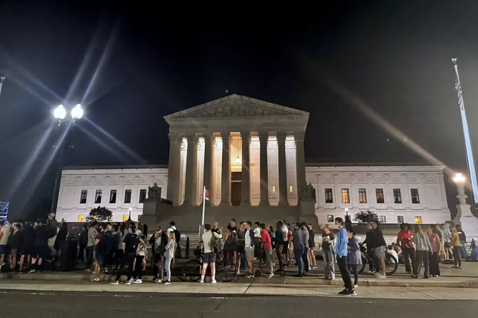 A crowd of people outside the Supreme Court on Monday night 