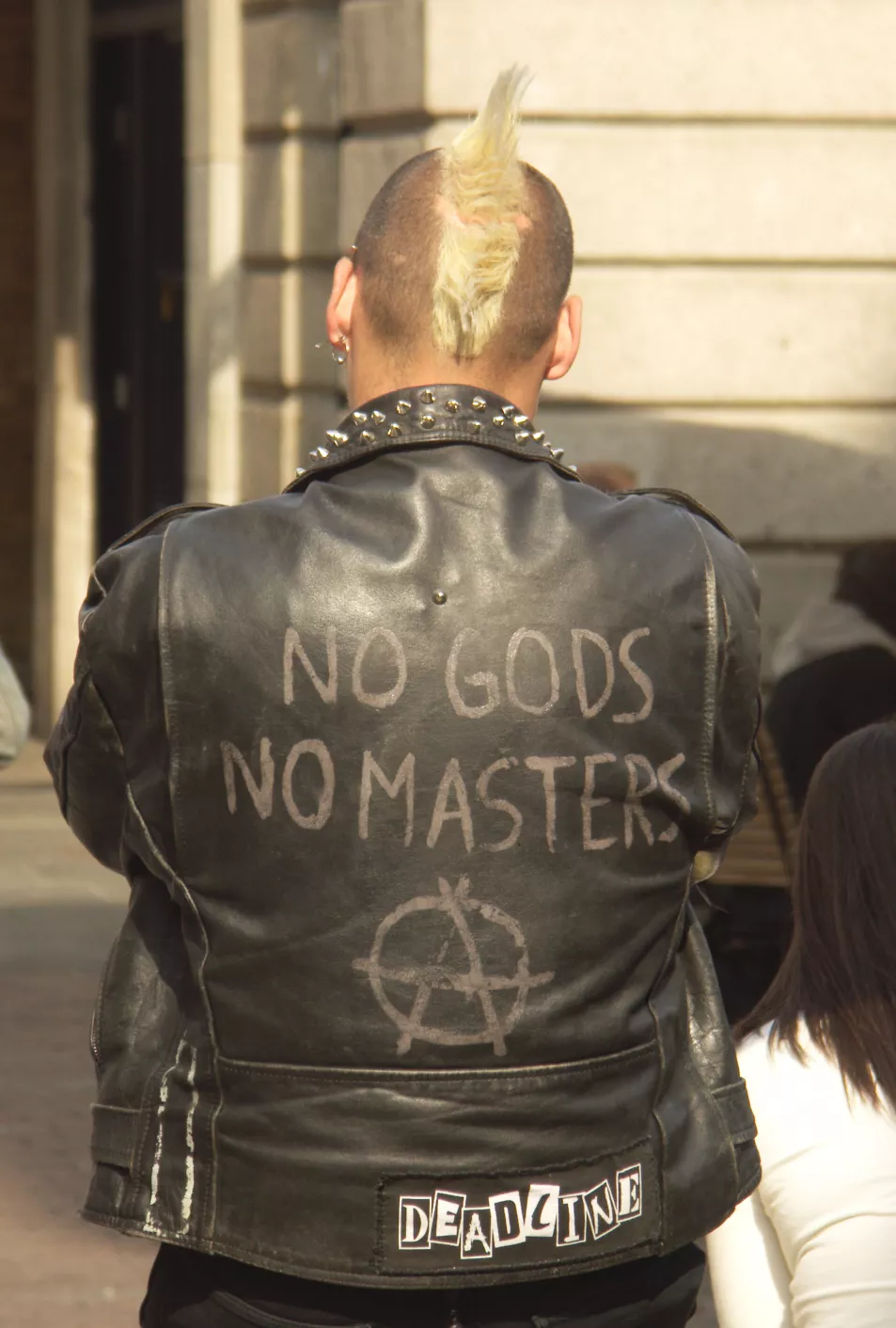 Male punk in anarchist jacket