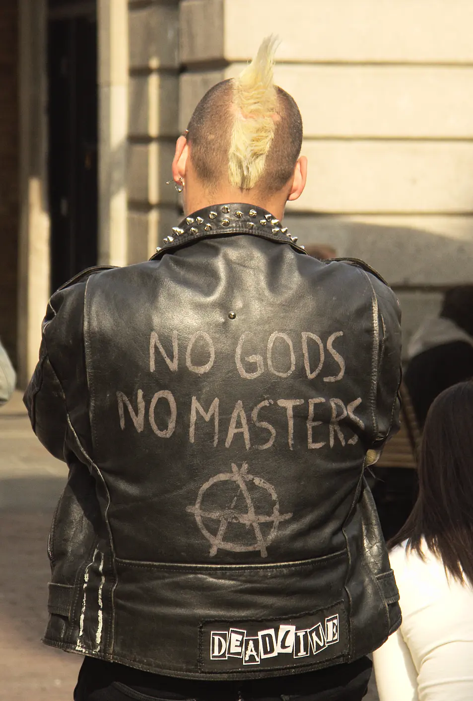 Male punk in anarchist jacket