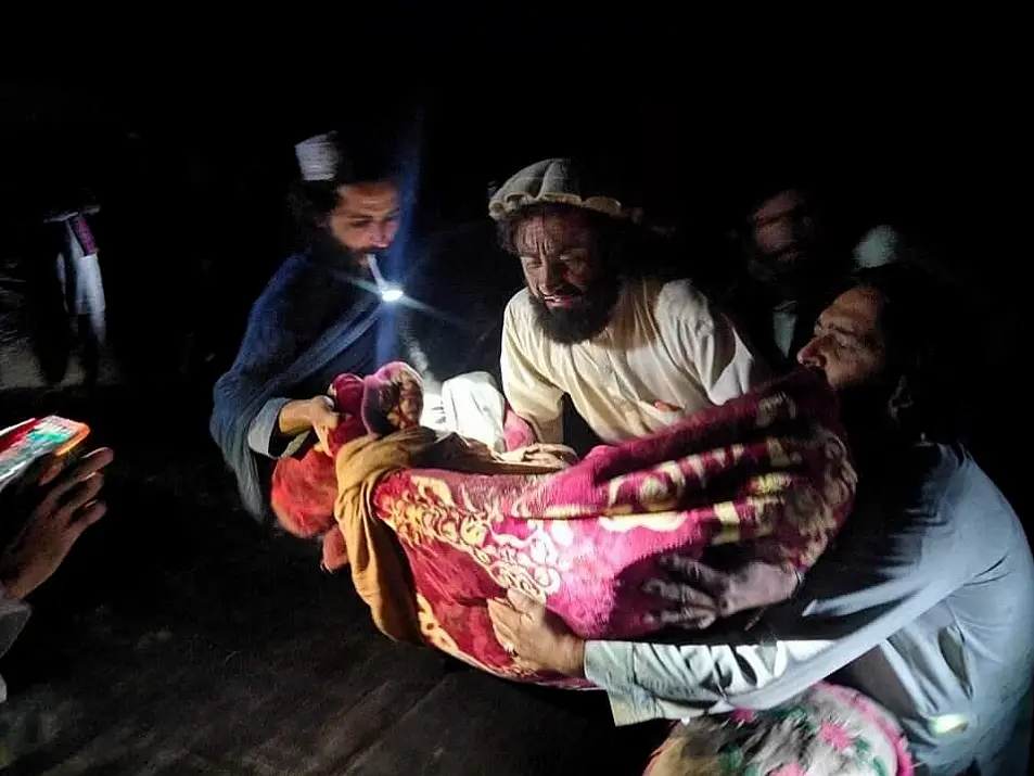 Afghans evacuate a person wounded in an earthquake in the province of Paktika, eastern Afghanistan