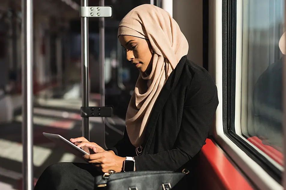 Woman using tablet on the train