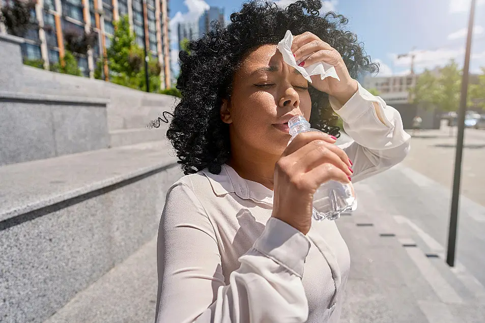 woman with headache in summer