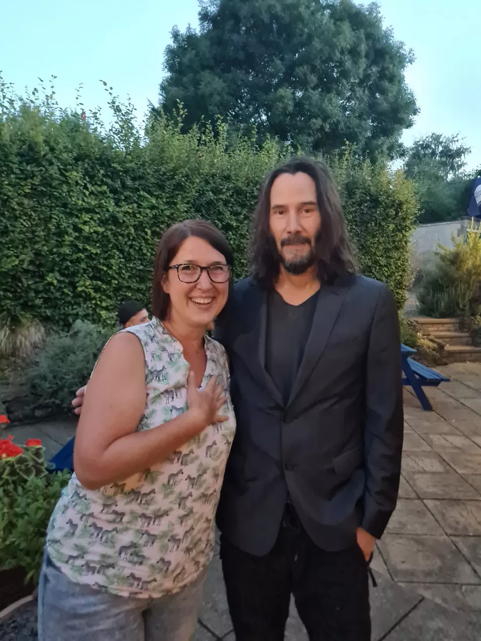 Dianne King, 46, poses with film star Keanu Reeves at her local pub. 