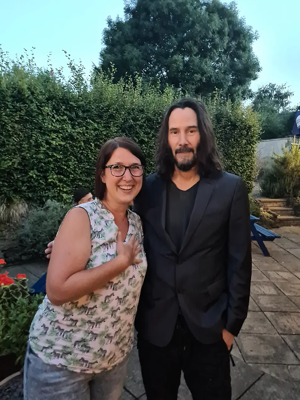 Dianne King, 46, poses with film star Keanu Reeves at her local pub. 