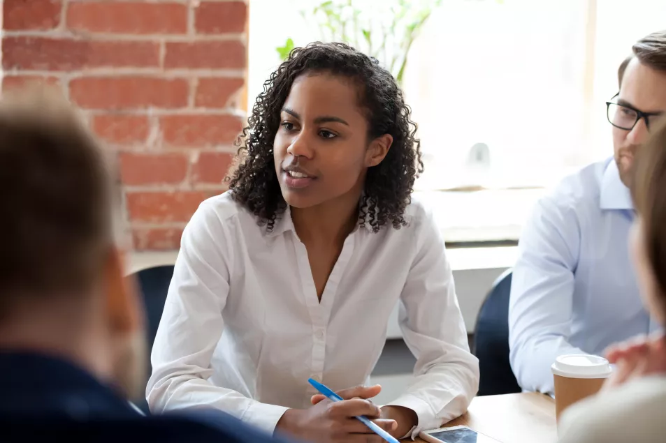 Woman talking to colleagues