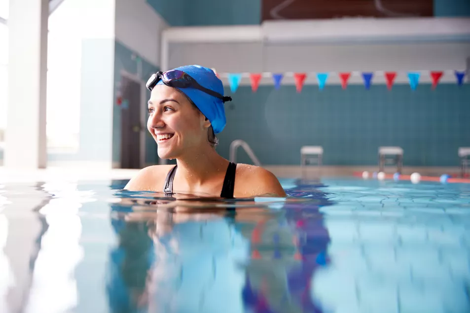 Happy smiling woman in a swimming pool