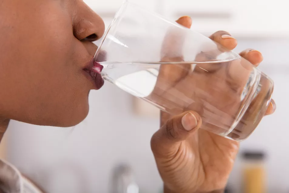Woman's Hand Drinking Glass Of Water