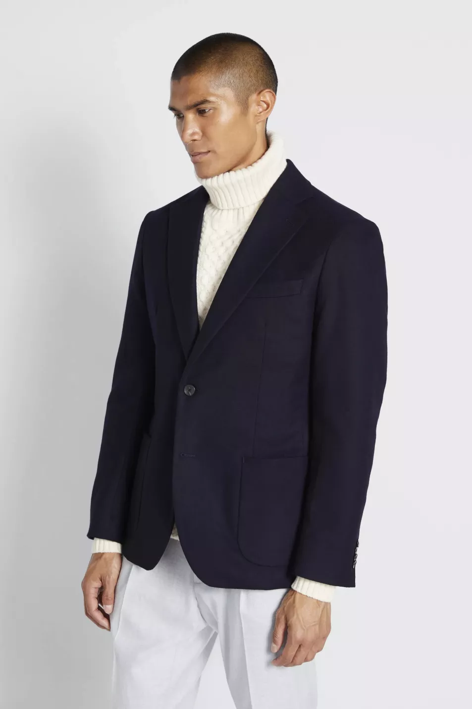 Moss Bros Navy Wool Jacket; Grey Chunky Cable Roll Neck Jumper; Slim Fit Stone Puppytooth Trousers