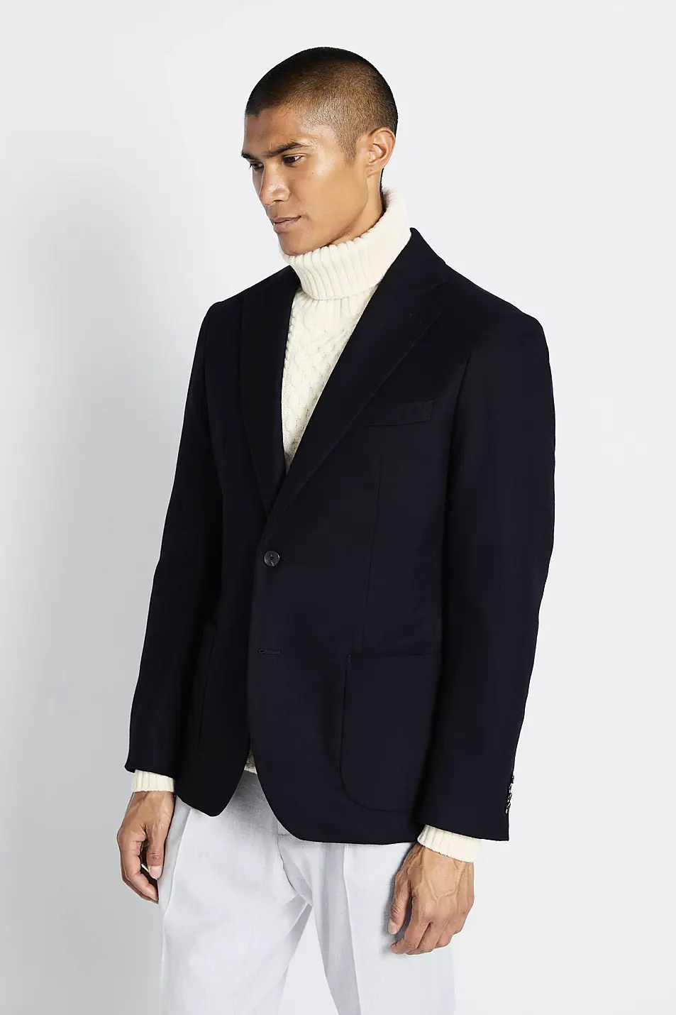 Moss Bros Navy Wool Jacket; Grey Chunky Cable Roll Neck Jumper; Slim Fit Stone Puppytooth Trousers