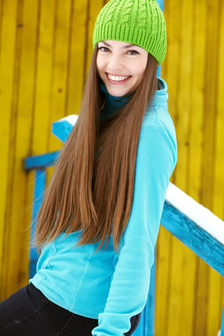 woman with long hair wearing beanie hat