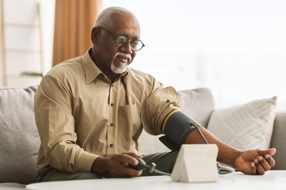 Mature man checking blood pressure