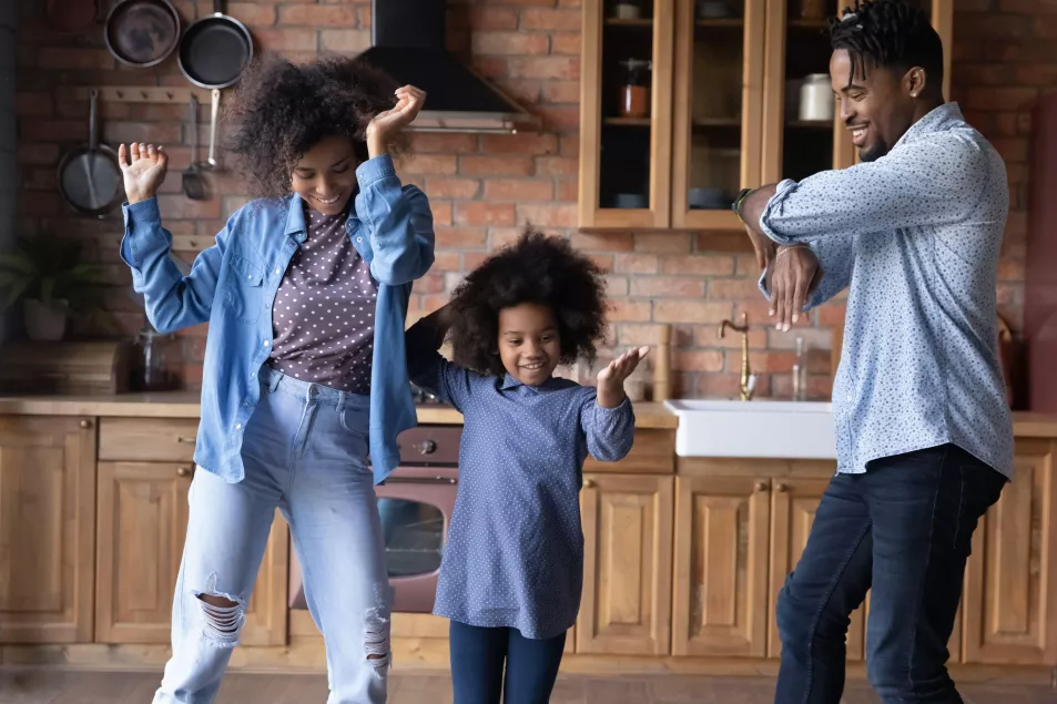 Family dancing in the kitchen