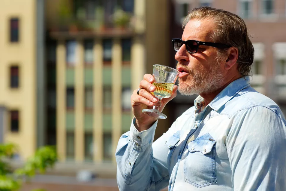 Man With A Denim Shirt Drink Alcohol