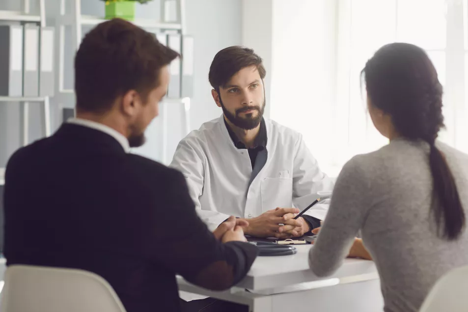 Couple visiting a doctor in a clinic office