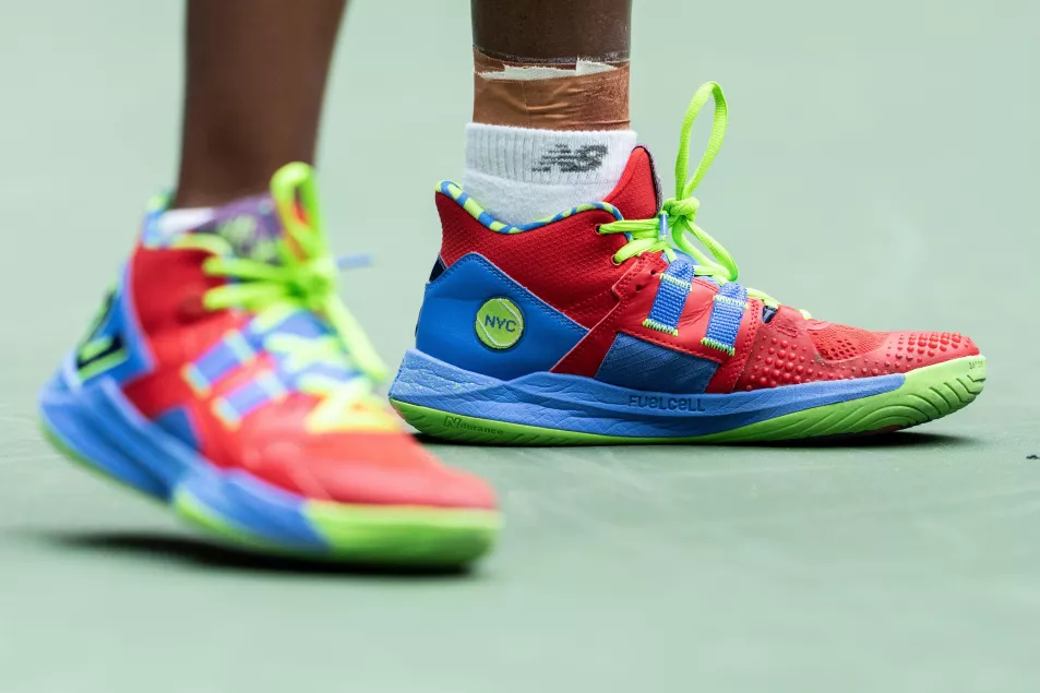 A close of up brightly coloured red green and blue high top tennis shoes