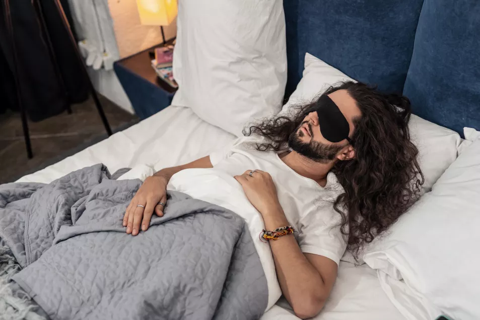 Bearded man wearing a special sleeping mask