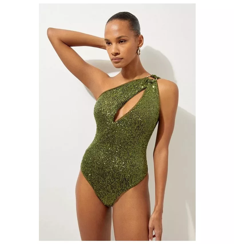 Model wears green sequined one-shoulder assymetric swimsuit with cut-detailing