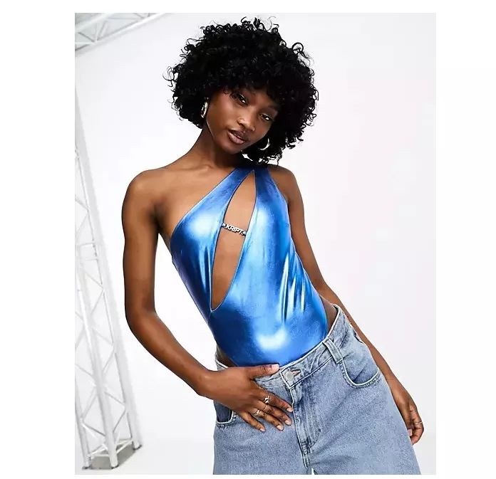 Model wears one shoulder blue metallic swimsuit with cut out detail