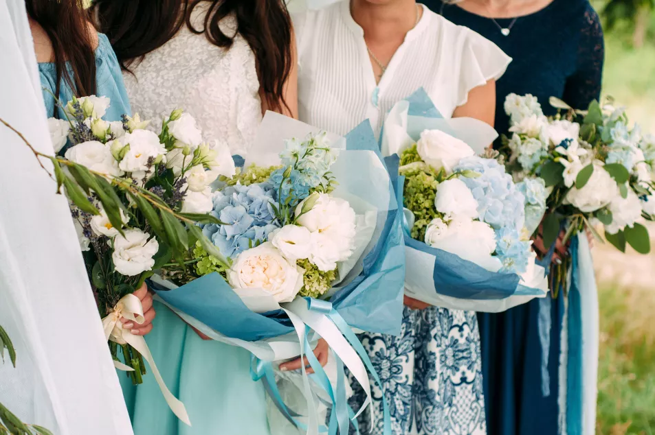 Guests at a wedding holding flowers
