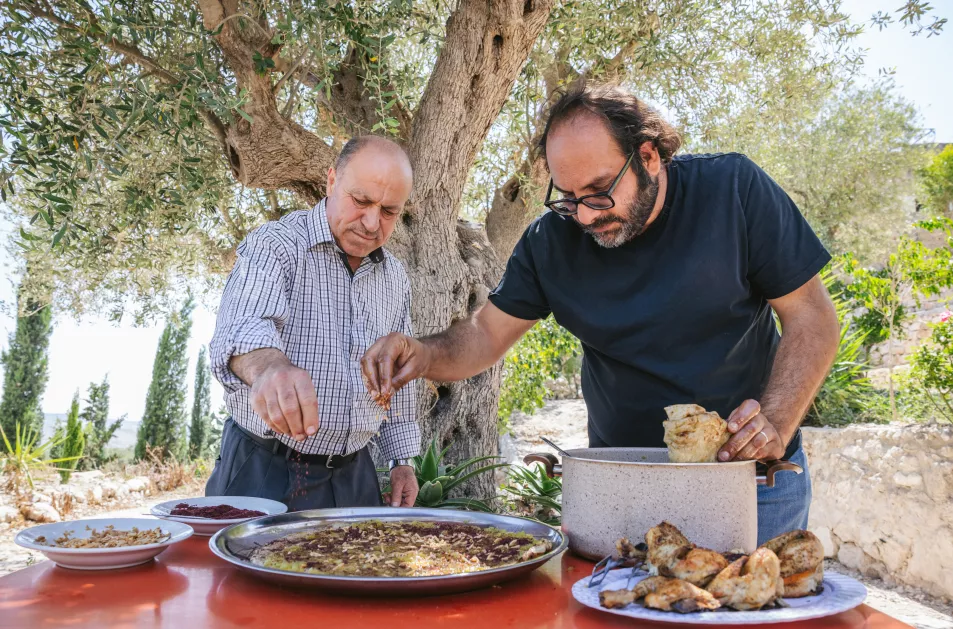 Kattan making musakhan with restaurant owner Abu Mohammad